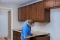 Installing contractors a laminate counter top a kitchen remodel Royalty Free Stock Photo