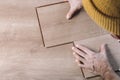 Installing laminate flooring in a room or office. Wooden parquet boards in the hands of a worker. Construction and Royalty Free Stock Photo