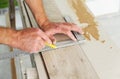 Installing laminate flooring. Royalty Free Stock Photo