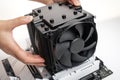 Installing a large cooler on a computer processor. Royalty Free Stock Photo