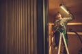 Installing LED Light Fixture in the Shed Ceiling Royalty Free Stock Photo