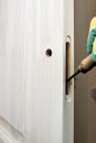 Cutting a hole for a door lock with a carpenter chisel