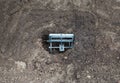 Installing a mole trap in a garden plot in a mole hole, close-up Royalty Free Stock Photo