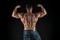 Installing muscles. Sportsman flex arms back view. Sportsman show biceps triceps. Strong sportsman or bodybuilder black Royalty Free Stock Photo