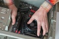 Installing a new motherboard in the system unit. Close-up of the hands of a master repairing a computer. selective focus Royalty Free Stock Photo