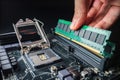 Installing a new RAM DDR memory for a personal computer processor socket in a service. Upgrade repair. PC upgrade or Royalty Free Stock Photo