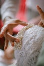 Installing Pearl Tiara on Bride Before the Wedding