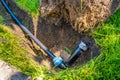 Installing a pop-up sprinkler in the lawn, close-up. Grass Irrigation Integration Royalty Free Stock Photo