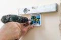 Installing a programmable room thermostat.