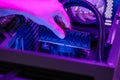 Installing RAM memory module into motherboard inside gaming computer, rgb lighting highlighting hardware upgrade, system assembly Royalty Free Stock Photo