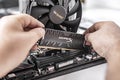 Installing random access memory into PC.