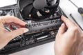 Installing random access memory into PC.