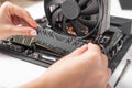 Installing random access memory into PC.
