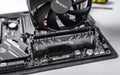 Installing random access memory into PC.