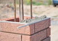 Installing Red Clinker Blocks and Caulking Brick Masonry Joints Exterior Wall. Royalty Free Stock Photo