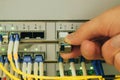 Installing the sfp module in the central router port in the data center server room. Creating a high-speed Internet connection Royalty Free Stock Photo