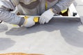 Installing Skylights in new home. Construction mason worker attach insulation material on Oriented Strand Board. Royalty Free Stock Photo