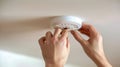 Installing a Smoke Detector. AI generated Royalty Free Stock Photo