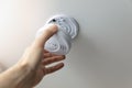 installing smoke detector on the room ceiling Royalty Free Stock Photo