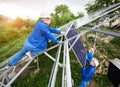 Installing of solar photo voltaic panel system Royalty Free Stock Photo