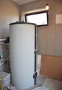 Installing solar water tank in boiler room. Solar water heating system. Royalty Free Stock Photo