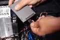 Installing a solid state drive in a computer,connect ssd disc Royalty Free Stock Photo
