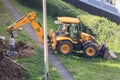 Installing well rings with a tractor bucket