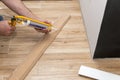 Installing white skirting board with caulking gun Royalty Free Stock Photo