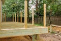 Installing wood floor for patio deck with new wooden planks Royalty Free Stock Photo