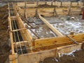 Installing wooden forms for pouring the Foundation concrete trench reinforced with reinforcement made of fiberglass