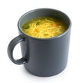 Instant chicken noodle soup in a grey ceramic mug isolated on white