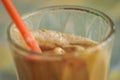 Instant coffe in a glass with a red straw Royalty Free Stock Photo