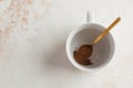 Instant coffee is poured into a white mug. July 24, instant coffee`s birthday. Copy space. Royalty Free Stock Photo