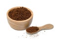 Instant coffee powder with wooden spoon and bowl isolated on white background Royalty Free Stock Photo