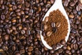 Instant coffee in spoon on coffee beans Royalty Free Stock Photo