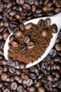 Instant coffee in spoon on coffee beans Royalty Free Stock Photo