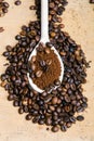 Instant coffee in spoon on coffee beans Royalty Free Stock Photo