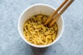 Instant Curry Flavored Ramen Noodles served with Chopsticks. in Plastic Cup Royalty Free Stock Photo