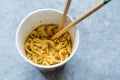 Instant Curry Flavored Ramen Noodles served with Chopsticks. in Plastic Cup Royalty Free Stock Photo