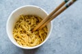 Instant Curry Flavored Ramen Noodles served with Chopsticks. in Plastic Cup Royalty Free Stock Photo