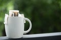 Instant freshly brewed white cup of coffee, Drip bag fresh coffee Royalty Free Stock Photo