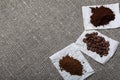 Instant, ground coffee and coffee beans. Against the background of coarse linen fabric. World Coffee Day Royalty Free Stock Photo