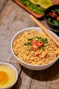 Instant noodle in bowl cooked spicy taste topping with eggs