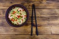 Instant noodle with shrimps, red pepper and green onion in a ceramic bowl. Japanese food. Top view Royalty Free Stock Photo