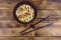 Instant noodle with shrimps, red pepper and green onion in a ceramic bowl. Japanese food. Top view Royalty Free Stock Photo