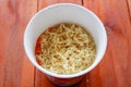 Instant noodles boiled , cook instant ramen noodles in a cup - noodle soup on paper bowl Royalty Free Stock Photo