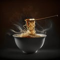 Instant noodles in a bowl with smoke and wooden spoon on dark background Royalty Free Stock Photo