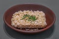 Instant noodles in a brown clay plate