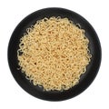 instant noodles on circle black plate isolated on white