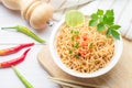 Instant noodles in paper bowl on white wooden background Royalty Free Stock Photo